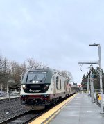 Northbound Amtrak Cascades Train # 500, with Charger # 1406 in the lead, zips past Kent Station with a Talgo Set.